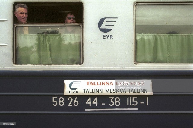 At the main station of the Estonian capital Tallinn, Travelers at a window of the «Tallinn-Express» that runs between Tallinn and Moscow (July 01, 1996).jpg