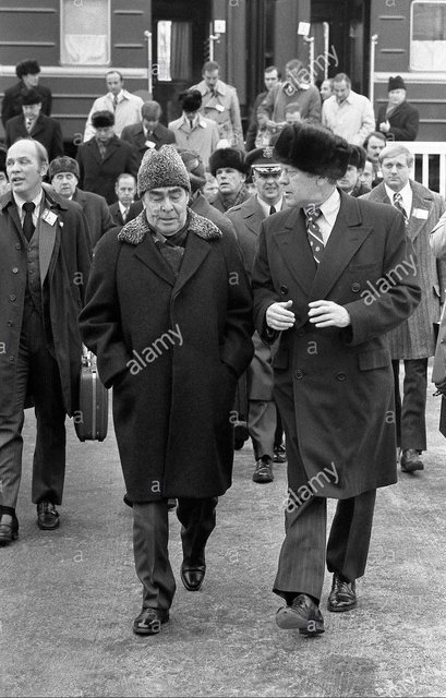 USA President Gerald Ford wearing a Russian fur hat walks with Soviet General Secretary Leonid Brezhnev after taking a train to the Okeansky Sanatorium November 23, 1974 in Vladivostok, USSR.jpg