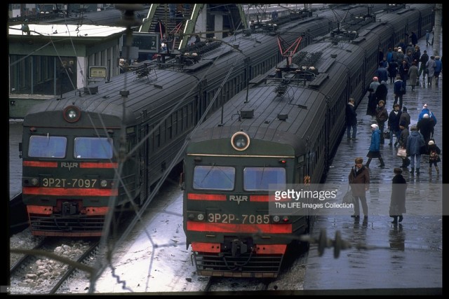 Platform-bound passengers, laden with shopping & overnight-sized bags being train at Belarusian train station, Moscow (February 19, 1992).jpg